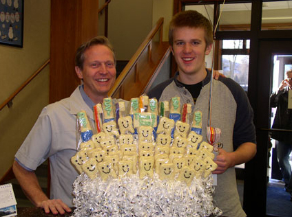 Dr. Bruce and patient with Thank you cookie bouquet